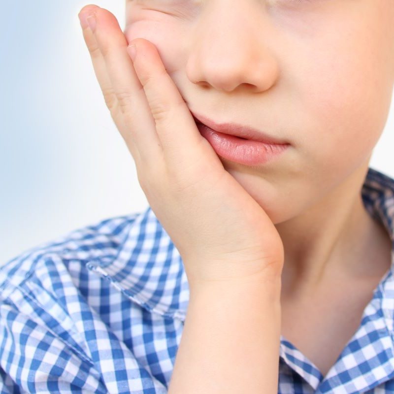 Boy Experiencing Dental Emergency