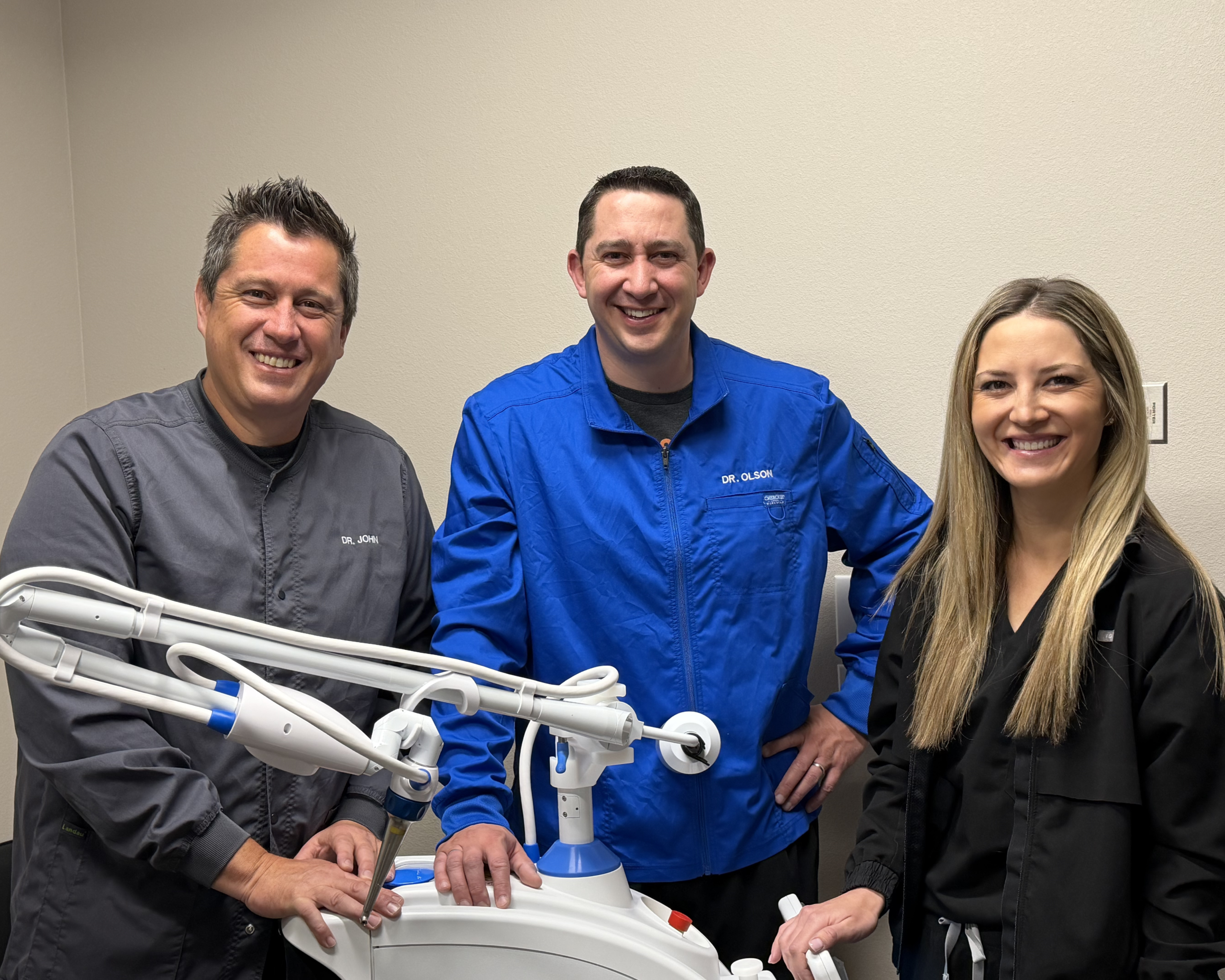 Dental professionals with medical equipment.